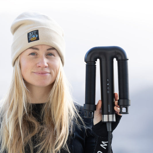 woman holds Hedgehog GO travel multi dryer